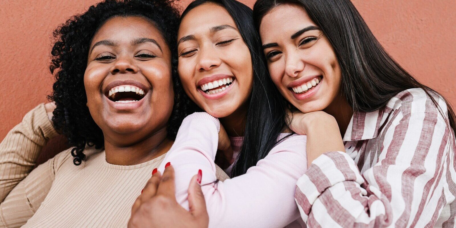 a group of women standing next to each other